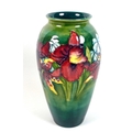 A Moorcroft pottery vase, circa 1950s, of ovoid form decorated with the 'Orchid' pattern, bearing La... 