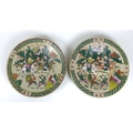 A pair of early 20th century Chinese  porcelain famille vert style chargers, each decorated with a g... 