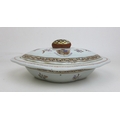 A Chinese armorial porcelain oval lidded tureen,  18th century, its lid with armorial crest to eithe... 