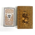 Two 19th century card cases, one with fretwork carved and engraved ivory centred by a heart, on a wo... 