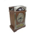 An Arts & Crafts style mantle clock, with an oak case, bell to top, pressed and hammered metal dial,... 