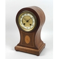 An Edwardian mahogany balloon shaped mantel clock, inlaid with shell paterae, 8 day movement chiming... 
