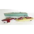 A group of three vintage early 20th century and later water vehicles, comprising an Unda-Wunda divin... 