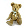 A Fortnum and Mason jointed bear, with humped back, mohair fur, suede pads and complete with origina... 