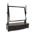 A Georgian mahogany toilet mirror, with rectangular mercury glass mirror plate on turned supports wi... 