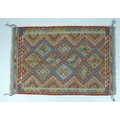A vegetable dyed wool Choli Kelim rug, 155 by 105cm.