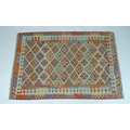 A vegetable dyed wool Choli Kelim rug, 190 by 130cm.