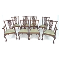 A set of Edwardian Chippendale style eight dining chairs including two carvers, with decorative top ... 