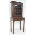 An Edwardian mahogany lady's bureau bookcase, of small proportions, dentil moulded cornice over a si... 