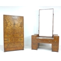 An Art Deco walnut veneered part bedroom suite, comprising a dressing table with rectangular mirror ... 