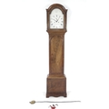 An early 19th century mahogany long case clock, plain white arched dial signed Thos Inskip, Shefford... 