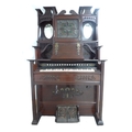 A late 19th century Canadian Clarabella harmonium, with mahogany case, a square form stained glass m... 