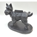 A humorous cast iron Scottie dog boot scraper,  depicted in standing pose mid-micturition, on an ova... 