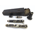 An early 20th century rosewood clarinet, with white metal fittings, the mouthpiece marked with Franc... 