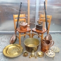 A group of copper and brass wares, including a jamming pan, brass ornaments and two 20th century ben... 