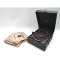 An HMV portable record player with some vinyl 78s records. (Record player and 1 bag).