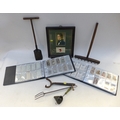 A group of collectables including two albums of vintage cigarette cards, including military themed c... 