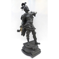A cast white metal figurine of ancient warrior, raised upon a wooden plinth, 78cm high.