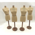 A group of four mid 20th century vintage Stockman table top mannequins, raised upon wooden stands wi... 