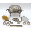 A collection silver and plated wares with coins, including a silver backed brush, mirror comb, a sil... 