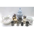 A group of various ceramics, including two Staffordshire style flatbacks, a lidded vase on wooden st... 