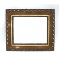 An Edwardian century mirror with bevelled edges, with mahogany and pierced gilt frame, 61.5 by 71.5c... 