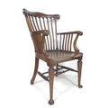 A mid 20th century mahogany Windsor style open armchair.