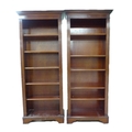 Two mahogany bookcases with adjustable shelves, each 76.3cm by 32cm by 183.5cm high overall. (2)