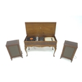 A Dynatron Radio Ltd HFC68 mahogany cased music unit, with turntable, 98 by 43 by 85cm high, with tw... 