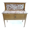 An Edwardian mahogany washstand, with red veined marble surface.