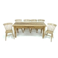 An early 20th century continental pine table and six associated late 20th century slat back birch ch... 