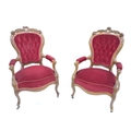 A pair of Victorian spoon back nursing chairs, with scrolling rococo crest rail, button backs and ca... 