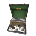 A Soberano Steel Reeds piano accordion,  with case, used but appears to be in working condition.