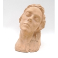 A plaster bust, modelled as a young lady, 32cm high.