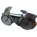A vintage Puch Touring gentleman's bicycle, British Racing green, with pannier racks.