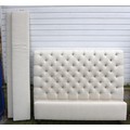 A modern upholstered bed, with button back headboard, 164 by 230 by 134cm.