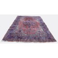 A large central Persian rug, with pink ground and floral decoration, a/f, poor condition, in need of... 