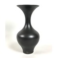 A modern studio pottery vase, in the style of Lucy Rie, of exaggerated baluster form, with wide flar... 