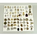 A collection of seventy three British military badges, including the Royal Marine Light Infantry, Ro... 