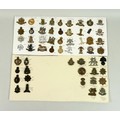 A group of fifty six British army badges, metal and plastics, including 15th the Kings Hussars, 8th ... 