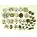 A small collection of twenty one British military badges and eleven buttons, including Royal Enginee... 