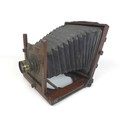 A Victorian wooden plate camera, apparently unmarked, together with a mahogany case containing a set... 