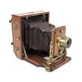 A Victorian J. Lancaster & Sons Instantograph patent field camera, mahogany cased, with leather bell... 