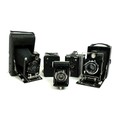 A group five vintage plate and box cameras, including two Contessa Nettel, an Ikonta 520/18, and a C... 