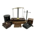 A group of vintage camera cases, boxes and other small suitcases, together with a damaged set of bal... 
