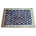 An Araak rug, with dark blue ground, boteh covered ground, cream border, 180 by 115cm.