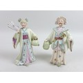 A pair of early 20th century Continental 'Nid Nod' ceramic figurines, modelled as a lady and gentlem... 