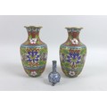 A pair of Japanese cloisonne vases of baluster form, with floral designs, both 7 by 15.5cm high, and... 