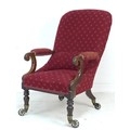 An early Victorian mahogany spoon back open armchair, with turned front legs and exceptionally large... 