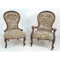 A Victorian mahogany open armed easy chair, with floral carved and moulded frame, padded arms, uphol... 